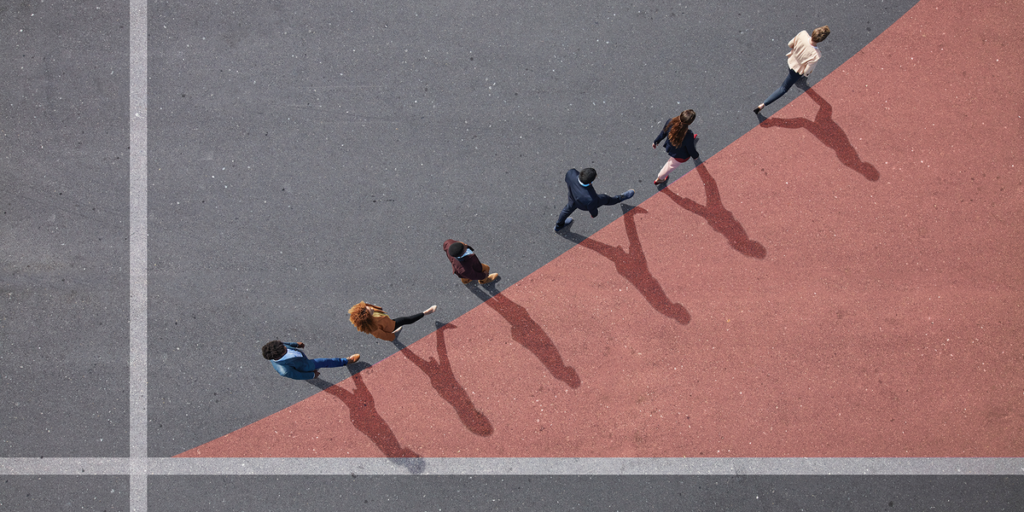 an-aerial-photograph-meant-to-look-like-a-graph-showing-six-people-walking-along-the-edge-of-a-pink.png